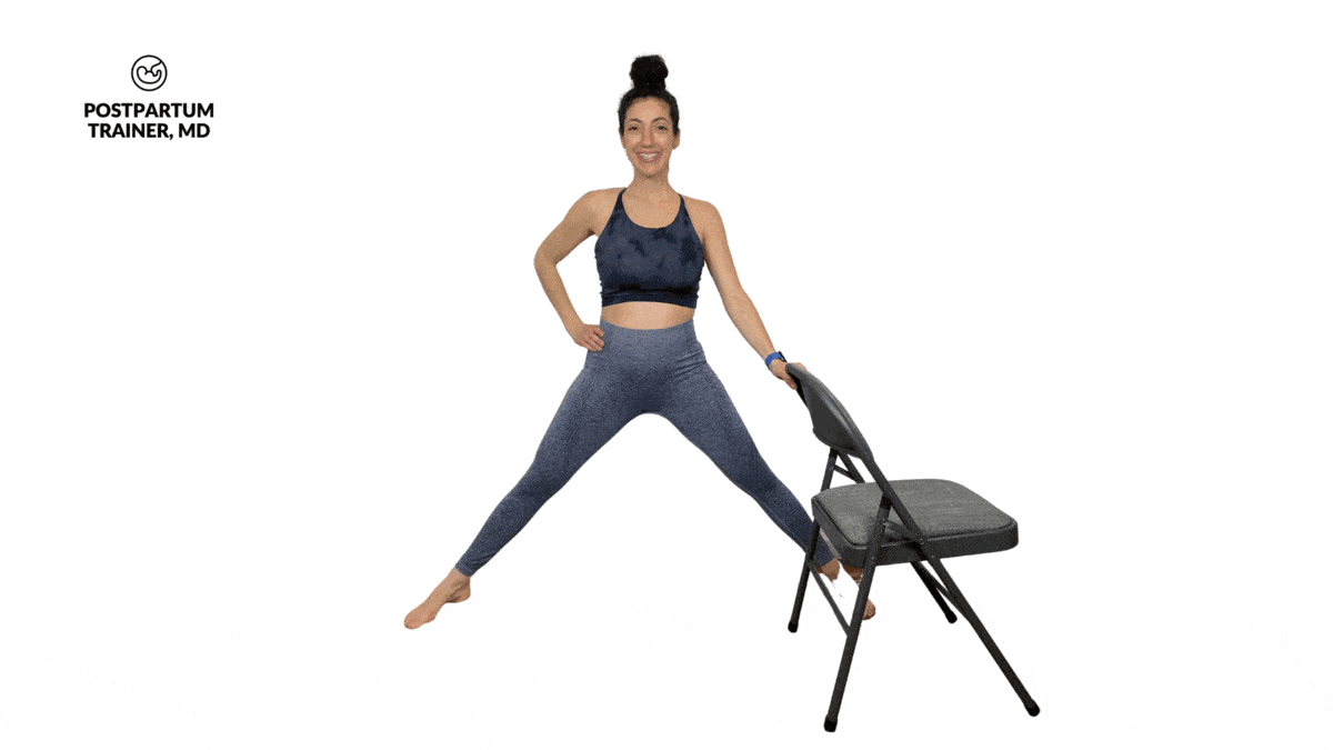 pregnant woman performing modified lateral lunge using a chair for balance