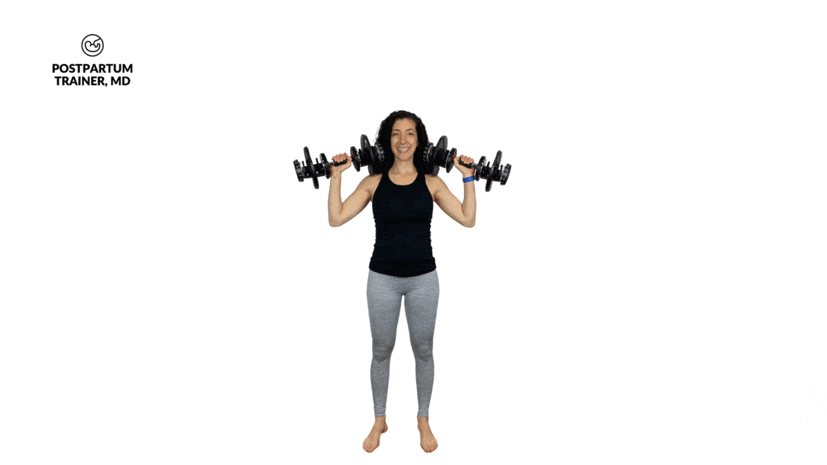 brittany pressing two dumbbells overhead 