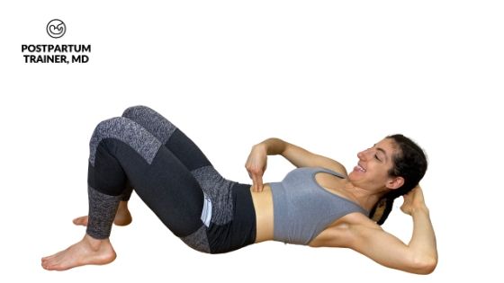 modified curl up position: brittany on her back curling her upper body slightly as she places her fingers in her abdomen