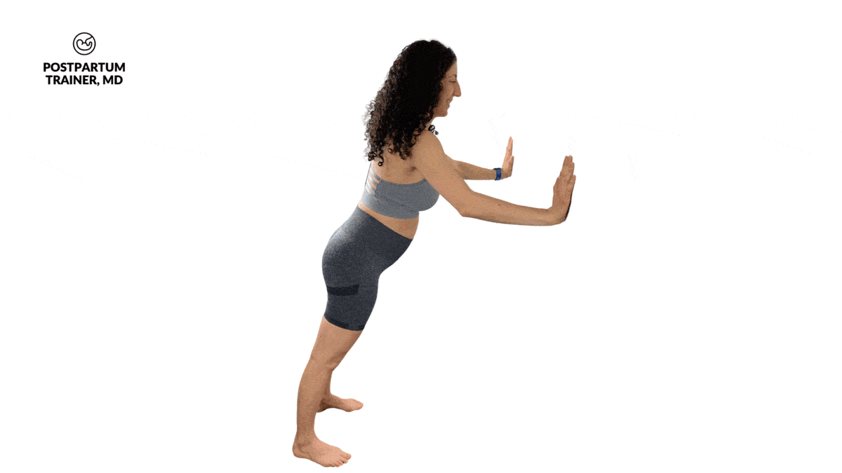 pregnant woman performing wall push up alternating close grip and wide grip