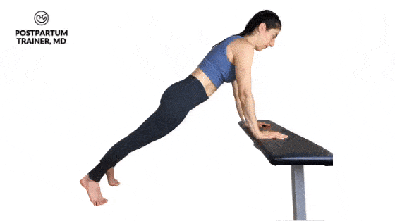 brittany doing an incline push-up with her hands elevated on a bench