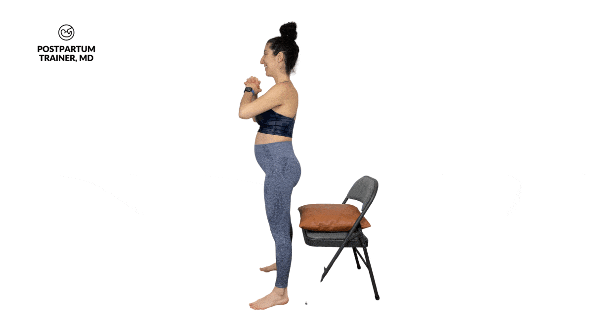 pregnant woman performing box squats on a chair