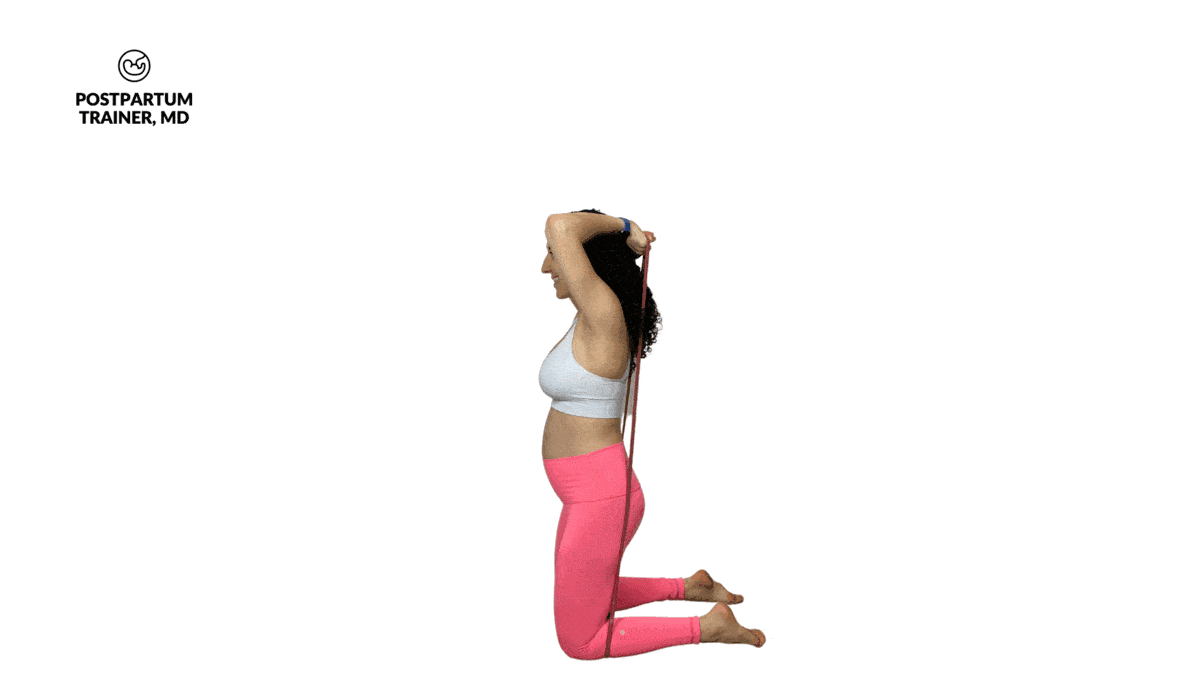 pregnant woman performing kneeling banded tricep extensions