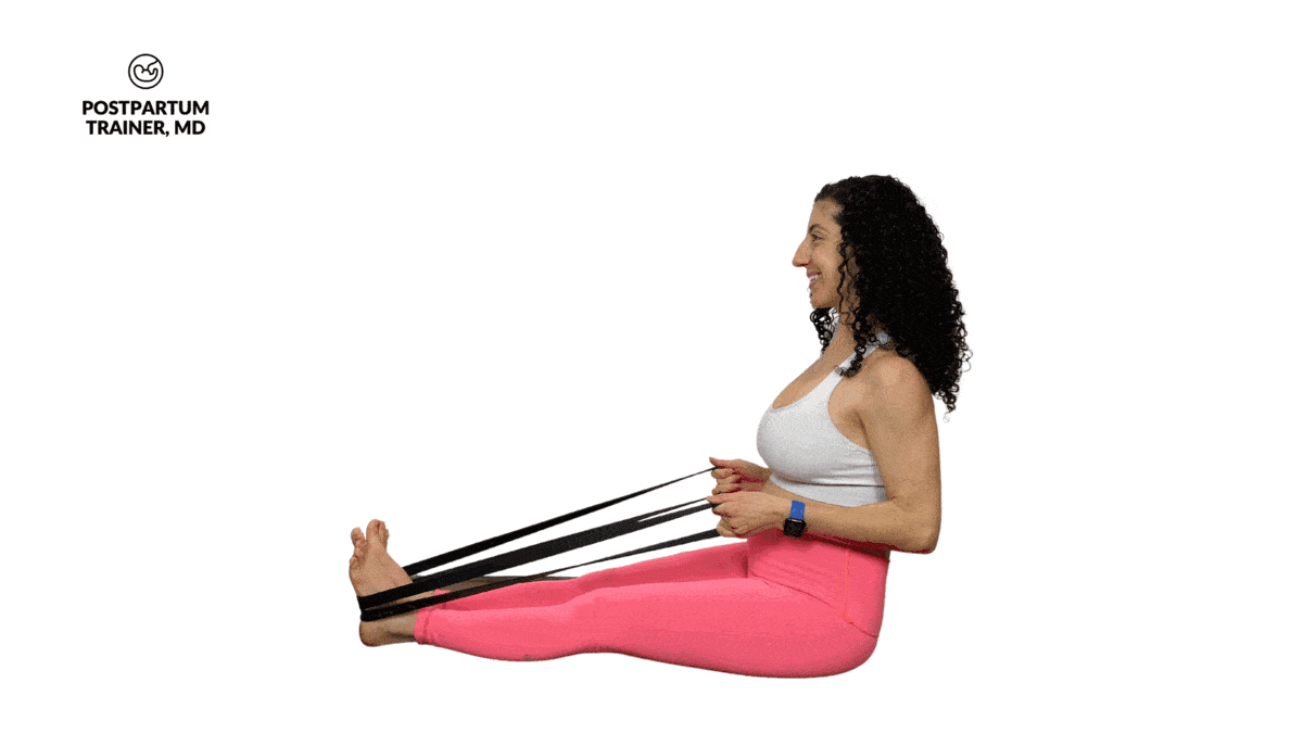 pregnant woman performing seated resistance band rows