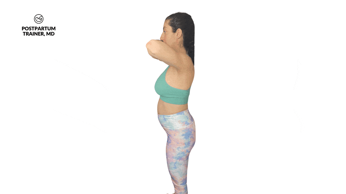 Pregnant woman performing standing pelvic tilts