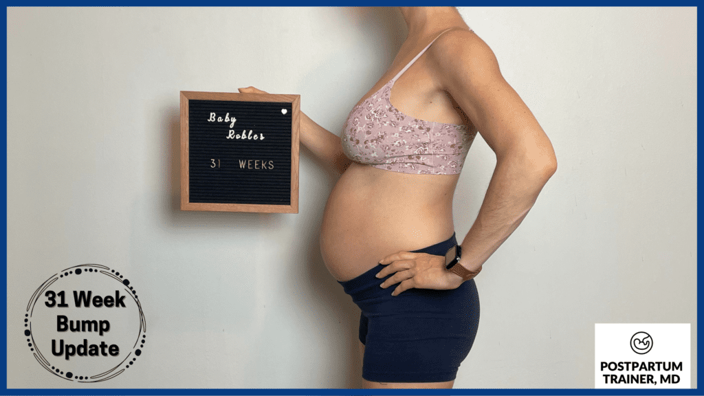 brittany holding up sign at 31 weeks pregnant from side