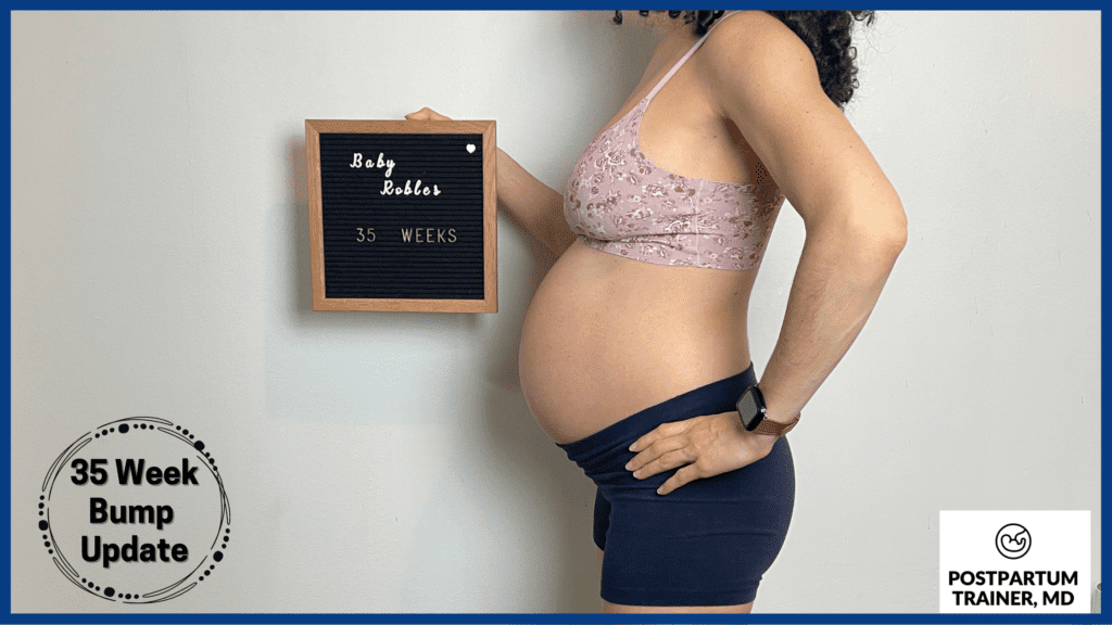 brittany holding up sign at 35 weeks pregnant from side