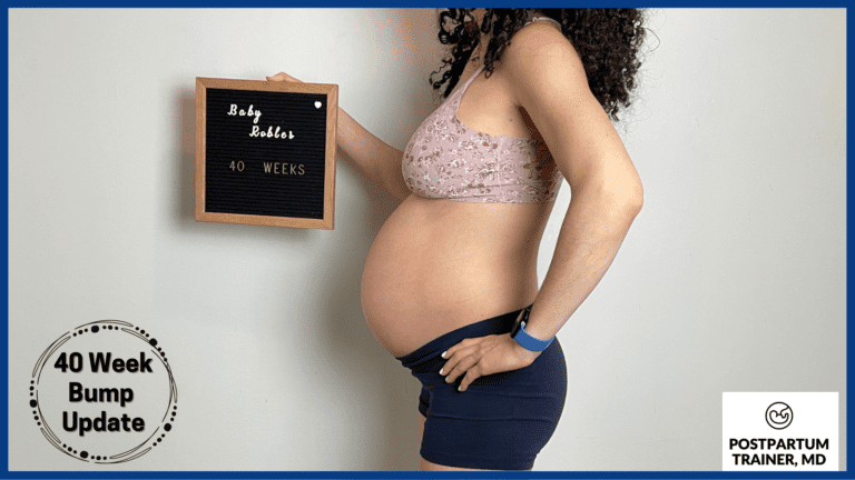 brittany holding up sign at 40 weeks pregnant from side
