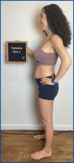 Britany holding up sign at 2 weeks postpartum