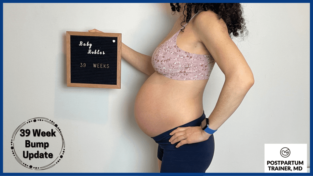 brittany holding up sign at 39 weeks pregnant from side