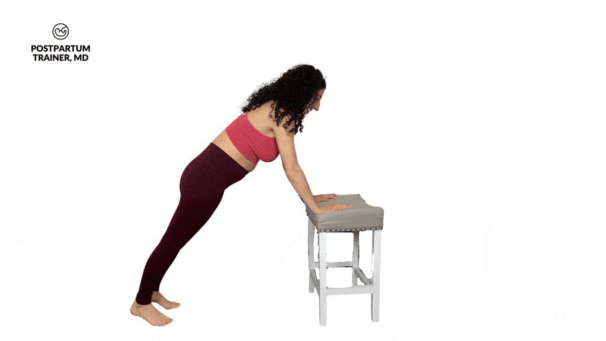 pregnant woman performing incline push up on a chair